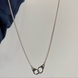 Brand new handcuff necklace with “freedom” engraving very tiny on both the cuffs